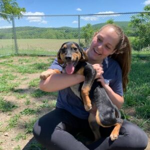 A woman holding a dog